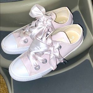 Pink converse with pink bow tie ribbons